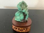 2 spelende budda’s in turkoois op sokkel, Ophalen