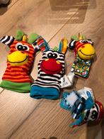 Rammelaar armbandjes + sokjes, Ophalen, Zo goed als nieuw, Rammelaar