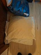 Pakket kussens en dekbedden, Ophalen