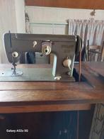 Naaimachine met trapper, Ophalen