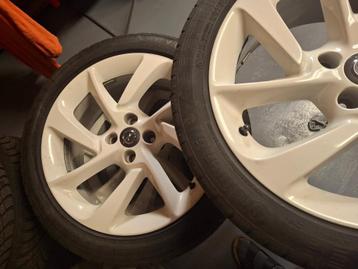 Vier velgen (Opel Adam) met winterbanden te koop beschikbaar voor biedingen