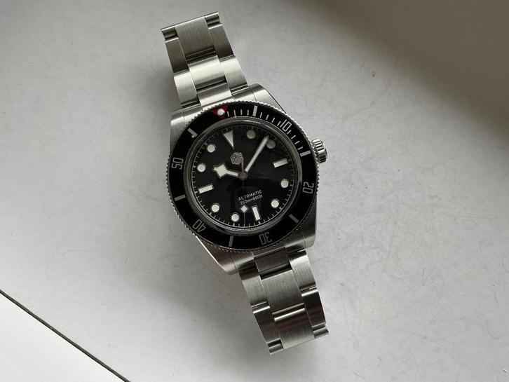 San Martin SN008 G-B in nieuw staat!, Handtassen en Accessoires, Horloges | Antiek, Polshorloge, Overige merken, Staal, 1960 of later