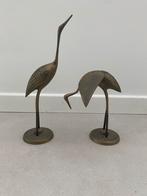 2 bronskleurige reigers, Ophalen