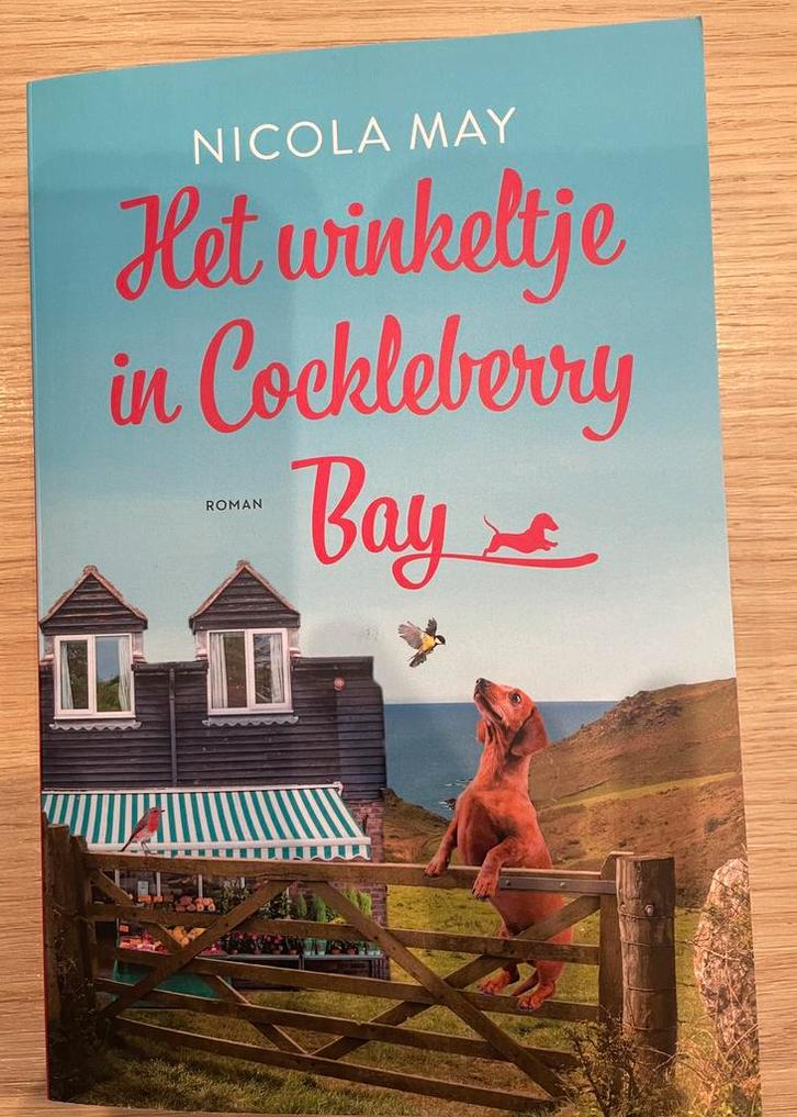 Nicola May - Het winkeltje in Cockleberry Bay, Boeken, Romans, Zo goed als nieuw, Ophalen of Verzenden