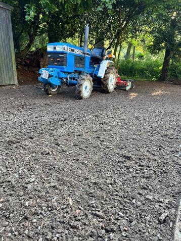 Mini-tracteur Tuinenleuckx, outils, grue et chauffeur à loue disponible aux enchères