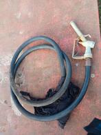 Tankpistool met slang, Ophalen