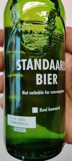 Heineken. Flesje met inhoud "standaard bier"., Verzamelen, Heineken, Ophalen of Verzenden, Zo goed als nieuw