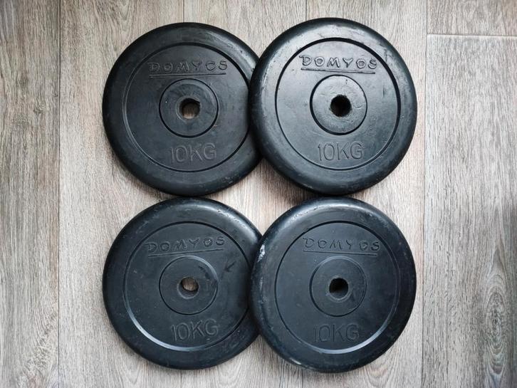 4 x 10kg Domyos halterschijven. (40kg), Sport en Fitness, Fitnessmaterialen, Halterschijven, Ophalen