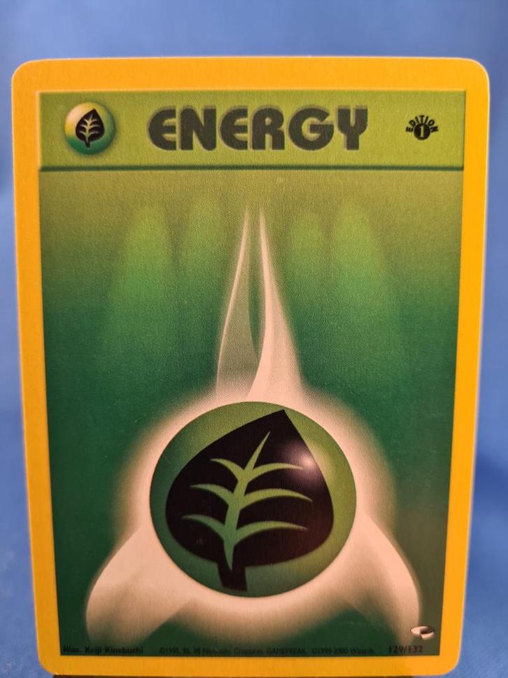 Grass Energy 129/132 - Gym Heroes (1st edition), Hobby en Vrije tijd, Verzamelkaartspellen | Pokémon, Gebruikt, Verzenden