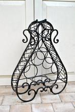 Mooi smeedijzeren wijnrek, Ophalen