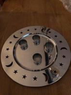 Kerstplateau met kaarjes, Ophalen