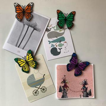 Vier vlinder magneten in verschillende kleuren