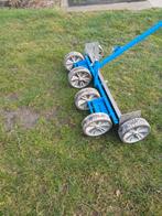 Hand nivelleer machine, Ophalen