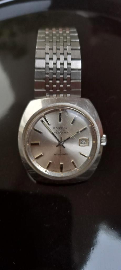 Pontiac Hydraulica Memodate – vintage jaren ’70, Handtassen en Accessoires, Horloges | Antiek, Polshorloge, Overige merken, Met bandje