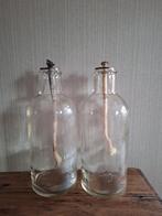 2 glazen flessen met lont, Ophalen