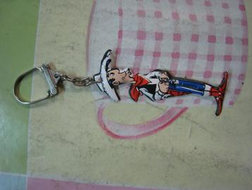Strip sleutelhanger Lucky Luke Waspoeder OMO Morris beschikbaar voor biedingen