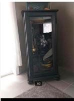 Zwarte vitrinekast, Ophalen