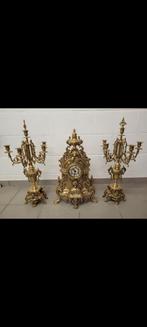 Klok met kandelaars, Ophalen