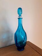 Blauwe karaf met stop, Ophalen