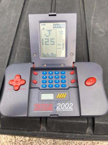 Vintage 2002 calculator gameconsole beschikbaar voor biedingen