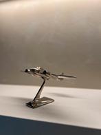 Metalen vliegtuig, Ophalen