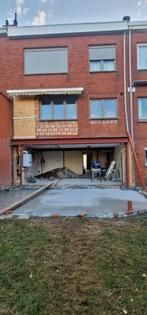 Muur afbreken en poutrel plaatsen.0465784727
