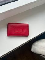 Delvaux portemonnee, Ophalen