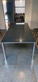 Zwarte glazen eettafel met metalen onderstel, Huis en Inrichting, Tafels | Eettafels, Ophalen, Gebruikt