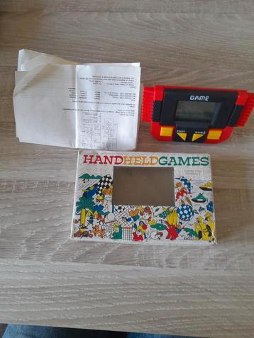 Hand held Games spelletje doosje papieren en game  disponible aux enchères