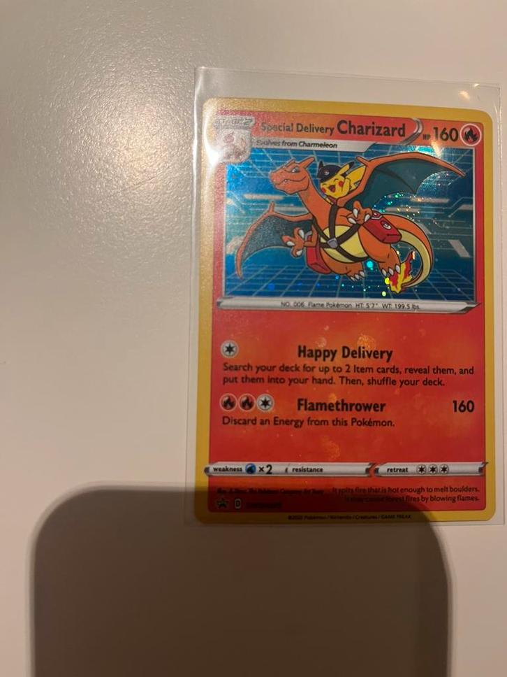 Delivery charizard, Hobby en Vrije tijd, Verzamelkaartspellen | Pokémon, Zo goed als nieuw, Ophalen of Verzenden
