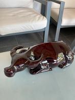 Houten buffel beeld, Ophalen