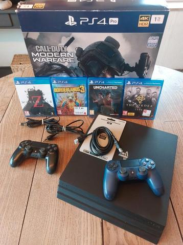 Ps4 pro 1to. Avec tous les câbles, 2 manettes et 4 jeux. beschikbaar voor biedingen