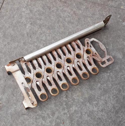 Metalen wand hanger uitklapbaar | merk Triumph, Antiek en Kunst, Curiosa en Brocante, Ophalen of Verzenden