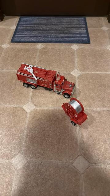Speelgoed Brandweerwagen met brandslangaanhanger!! beschikbaar voor biedingen