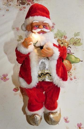 Kerstman speelt muziek, decoratie of lumineus speelgoed