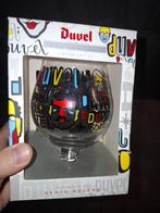 Duvel glas Denis Meyers BE doos, Verzamelen, Ophalen of Verzenden, Zo goed als nieuw, Glas of Glazen, Duvel