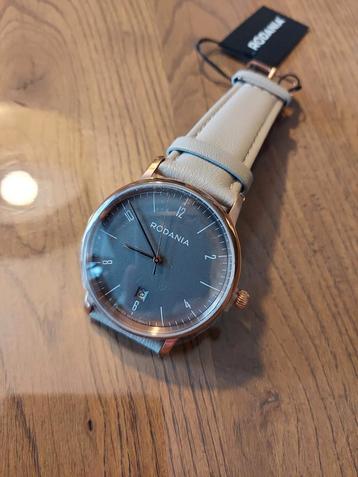 horloge unisex dames/heren,rodania,met leren bandje en datum beschikbaar voor biedingen