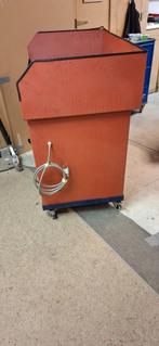 Wasmachine voor mechanische onderdelen, Ophalen