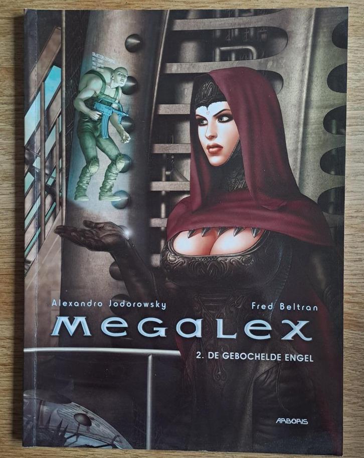 2 - Megalex - De Gebochelde Engel, Boeken, Stripverhalen, Zo goed als nieuw, Eén stripboek, Ophalen of Verzenden