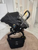 Doona autostoeltje + luiertas + regenhoes + voetenzak, Kinderen en Baby's, Buggy's, Ophalen, Zo goed als nieuw, Regenhoes