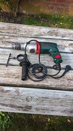 Fourreuse avec clé de serrage et manche de percussion