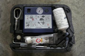 Mini kit d'urgence - kit de gonflage disponible aux enchères