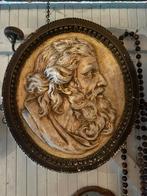 Zware plaquette in gips, Ophalen