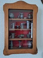 Kastje gevult met tinnen voorwerpjes, Ophalen