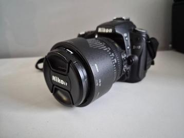 Nikon D90 + 18-105mm VR lens + tas + oplader – goede staat beschikbaar voor biedingen