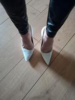 Sexy witte hakken maat 42, Ophalen