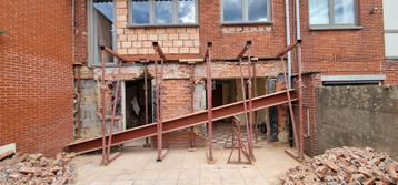 Achtergevel afbreken en poutrel plaatsen. 0466 49 87 53  beschikbaar voor biedingen