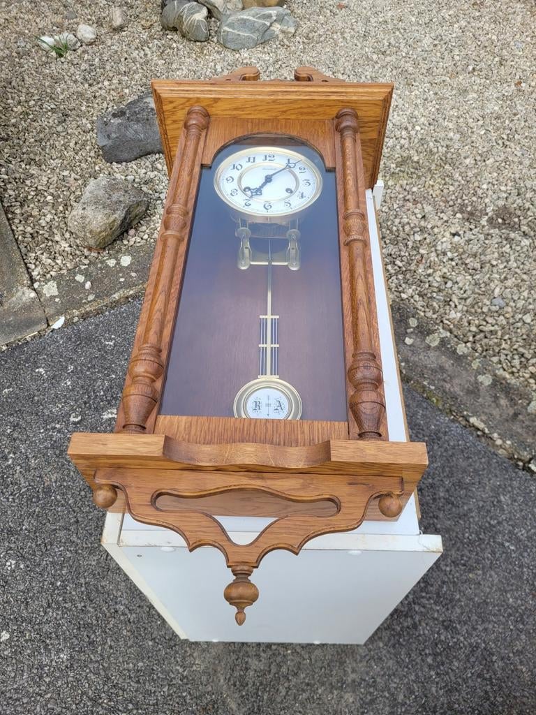 Antieke hangklok, Ophalen