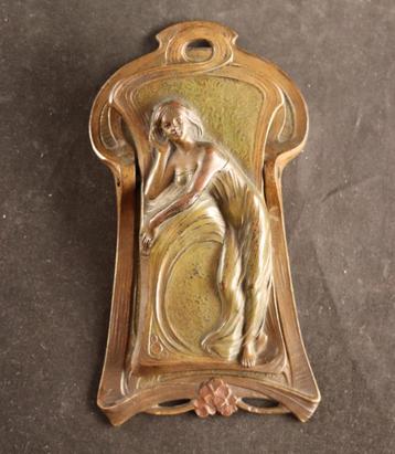 Antieke bronzen paperclip beschikbaar voor biedingen