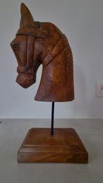 Houten paardenkop, Ophalen